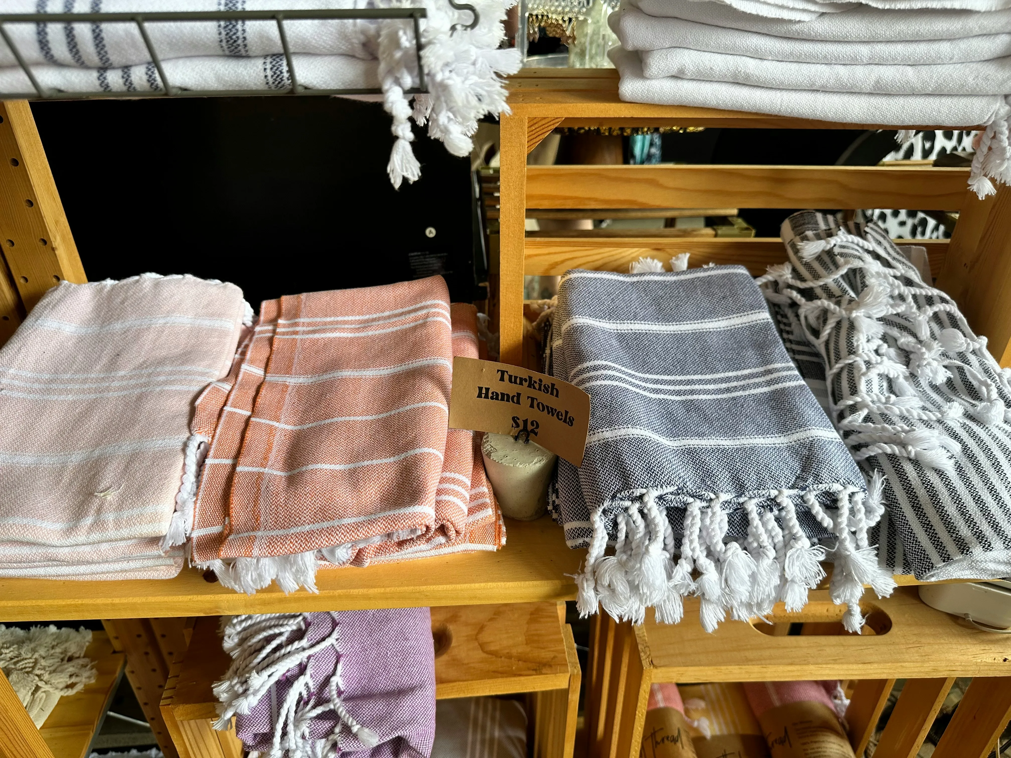 Several tagged kitchen towels