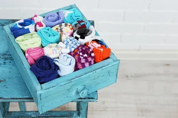 Socks folded and packed into a drawer