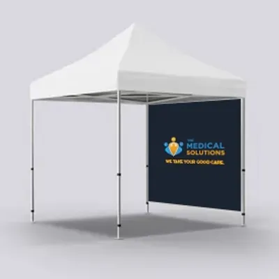 Full Right Wall Both Sided A white trade show tent with a custom banner that reads 'MEDICAL SOLUTIONS - WE TAKE YOUR GOOD CARE' with a logo, displayed in a neutral setting.