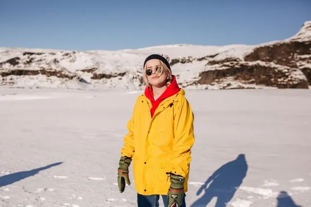 a person wearing sunglasses on snow covered ground for do you need anti reflective coating on sunglasses