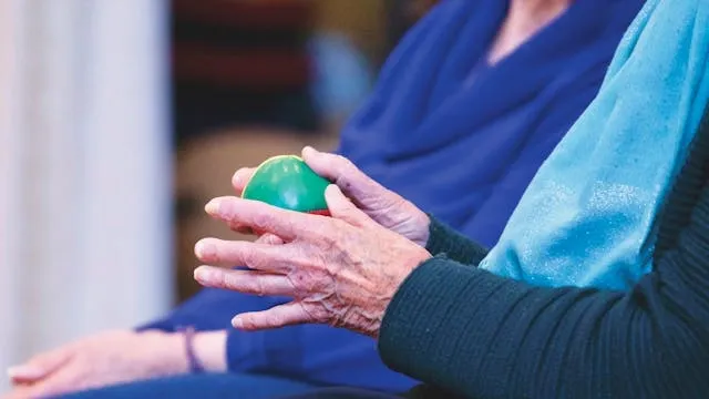 an elderly person holding a ball for what are stress balls made of