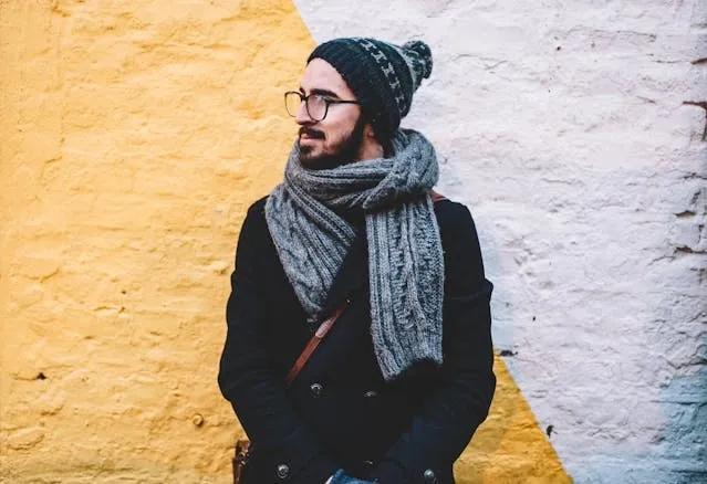 a person wearing a thick wool scarf for types of scarves